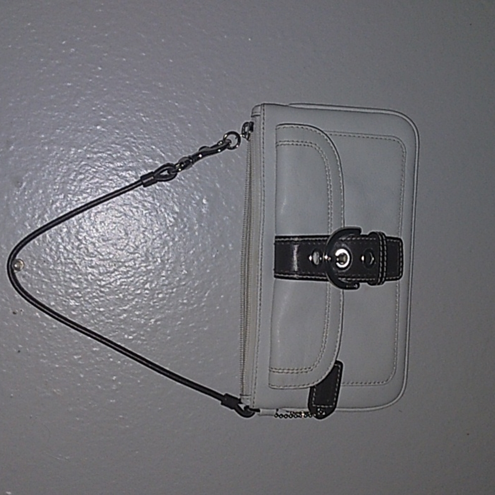 A leather white mini coach purse